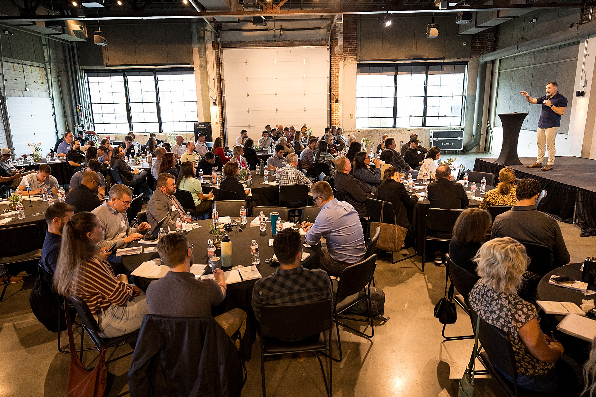 Multiply Anchor Partners gathering — leaders at round tables